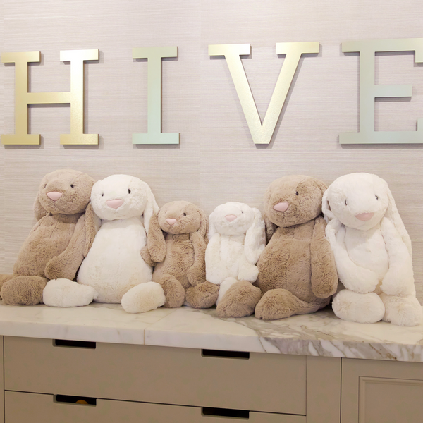Row of stuffed bunnies on Hive counter