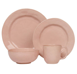 The Juliska Puro Blush Dinnerware Collection features a four-piece set—including dinner plate, salad plate, bowl, and mug—in a stylish blush pink ceramic for an elegant table setting.
