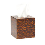 The Pigeon & Poodle Carmel High Gloss Faux Tortoise tissue box features a brown, marble-like pattern inspired by classic tortoise shell, with a white tissue partially pulled out from the top.