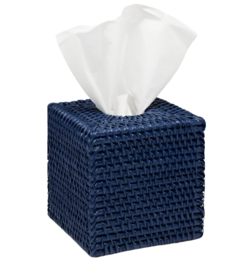 The Dalton Bath Collection by Pigeon & Poodle features a navy blue tissue box holder, handcrafted from rattan with organic dyes and finished with detailed craftsmanship, displaying a white tissue at the top.