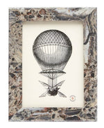 Vintage hot air balloon illustration with detailed basket and rigging, set against a plain background in a 5 x 7 Pigeon & Poodle Mixed Gray Marble Corsica Frame.