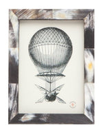 Black and white vintage hot air balloon illustration in a 5" x 7" Dark Horn Essen frame by Pigeon & Poodle—an ideal addition to any frame collection.