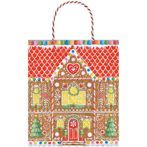The Gingerbread House Collection gift bags by Caspari feature a festive gingerbread house, candy accents, two Christmas trees, and a red and white twisted handle—perfect for decorative holiday gifting.