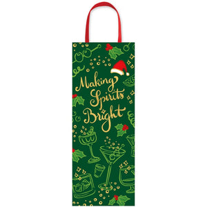 The Caspari Making Spirits Bright Bottle Bag features gold text, holiday illustrations, red handles, and a Santa hat graphic—perfect for gifting bottles in festive, designer style.