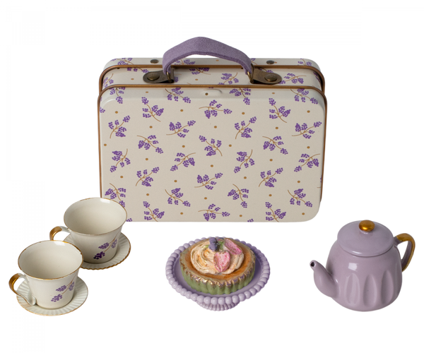 A Maileg Purple Madelaine Afternoon Treat tea set with cupcakes and a suitcase.