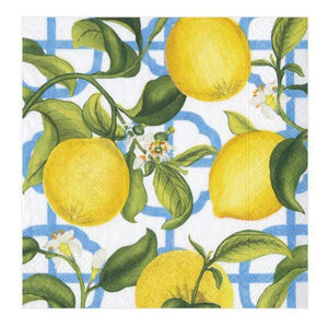 The Seville Ivory Collection napkins by Caspari feature yellow lemons and green leaves on branches over a white background with a blue geometric lattice design.