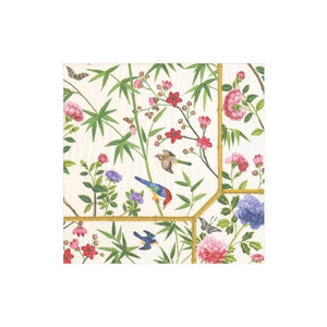 The Caspari Chinese Silk Ivory Collection triple-ply napkin features birds, bamboo, cherry blossoms, and colorful flowers on a cream background.