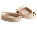 The Burma Whitewash Oval Serving Tray Collection by Napa Home & Garden features three oval woven rattan trays with handles, stacked on a white background to highlight their exquisite Burmese craftsmanship.