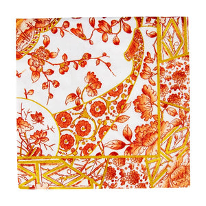 A square, eco-friendly napkin from Caspari's Gilded Porcelain Coral Collection featuring a detailed red, orange, and yellow floral and geometric pattern on a white background.