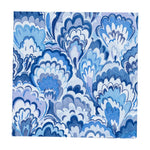 Layered, scallop-shaped patterns in blue and purple on white evoke marbled waves, reflecting the elegance of the Marbled Ceramica Collection by Caspari.