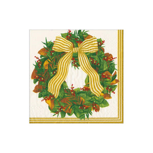The Caspari Magnolia Wreath Collection features sturdy white triple-ply napkins with a festive green wreath, red berries, brown leaves, a gold striped bow, and gold-edged lines—perfect for any celebration.