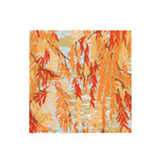 The Willows Coral Collection by Caspari features willow branches with orange, yellow, and red leaves over water—an ideal fall inspiration for table settings or seasonal paper products in party planning.