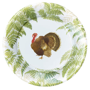The Caspari Turkey Among Ferns Partyware Collection features a decorative plate with green fern borders and a central turkey illustration, ideal for festive Thanksgiving tableware or themed gatherings.