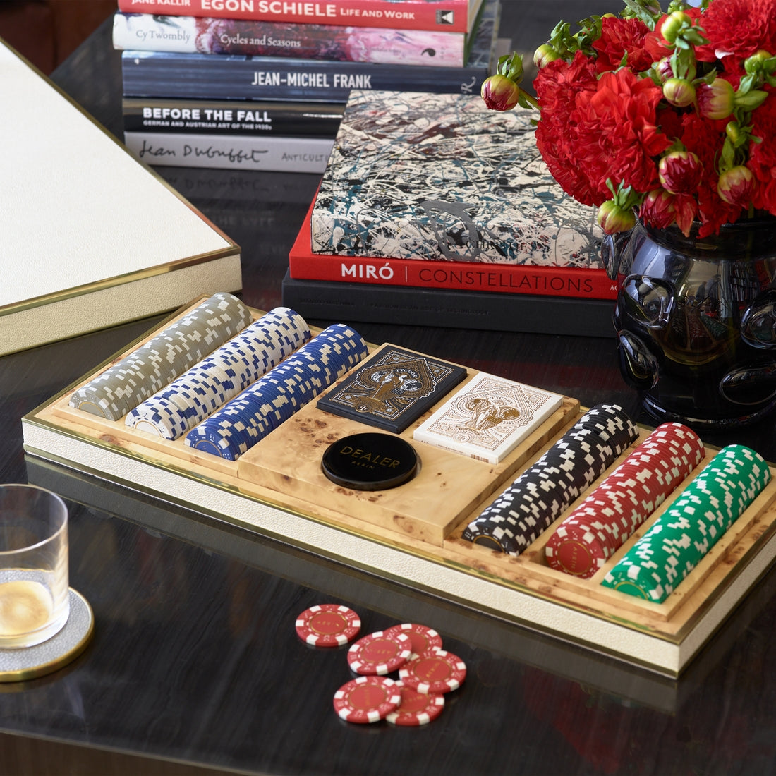 The Aerin Shagreen Poker Set, Cream features multicolored chips, cards, and a dealer button in a luxurious shagreen case—an elegant addition to any game night.