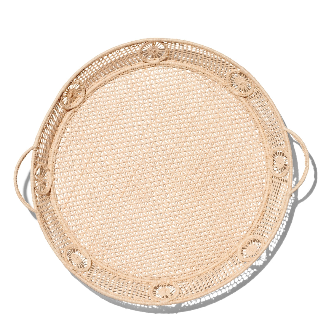 The Aerin Raffia Round Tray features two handles and decorative circular patterns, perfect for serving or displaying accessories in a coastal style. Shown on a white background.