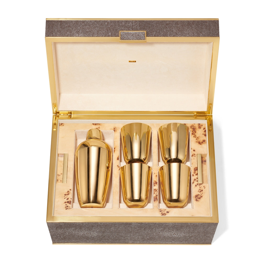 The Aerin Chocolate Classic Shagreen Bar Set features a gold-toned cocktail shaker and three matching cups in a beige, suede-lined shagreen box with a hinged lid—an elegant addition to any home bar.