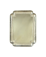 The Carvers' Guild Big Double Cove Mirror is a rectangular silver tray with rounded, indented corners and a bold mirror-like reflective surface, photographed against a white background.