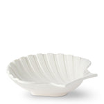 The Aerin Cream Shell Platter Collection features white earthenware ceramic dishes shaped like seashells, perfect as serving platters for adding coastal style to your table. Shown on a plain white background.