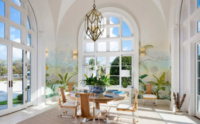 hand painted tropical mural, sitting area, and large windowed doors in McCann Design Group