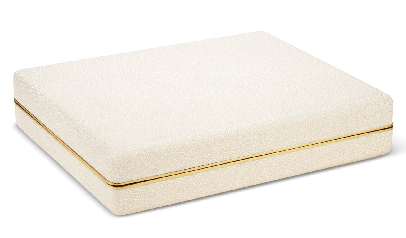 A white AERIN jewelry box with brass detailing.