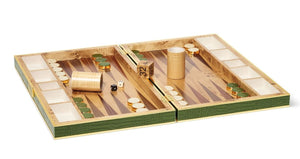 The Aerin Croc Leather Backgammon Set showcases green and white points, wooden checkers, dice, a doubling cube, and dice cups—all presented on a luxurious Italian crocodile leather surface.