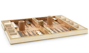 The Shagreen Backgammon Set, Cream by Aerin features a luxurious shagreen finish, white and black checkers, two dice cups, a doubling cube, and dice on a cream-colored wooden board.