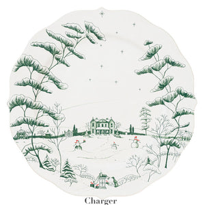 The Juliska Country Estate Winter Frolic Evergreen Dinnerware Collection features a white charger plate with scalloped edges, adorned with a green winter landscape—ideal for festive country estate gatherings.