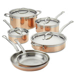 The Hestan CopperBond 10-Piece Set features 5-ply copper and stainless steel construction for even heating—includes two frying pans, three lidded saucepans, and a sauté pan with lid. Induction compatible; shown on a white background.