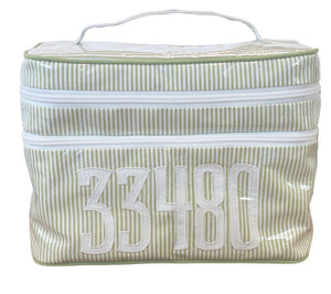 The Walton Travel Case by Walker Valentine is a rectangular packing organizer, green and white striped, with double zipper compartments and the number 33480 in bold white letters on the front.