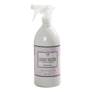 A 32 fl. oz. spray bottle of Le Blanc Linen Water Spray, ideal for giving household linens and fine apparel a fresh scent.