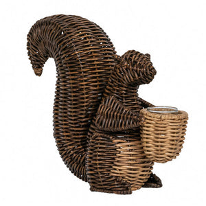 The Juliska Devon Willow Squirrel Flameless Candle Holder is a charming hand-woven accent featuring a squirrel with a small basket, perfect as home décor or for holding a flameless candle.