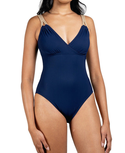 Woman wearing a navy blue maillot with cotton rope straps and moderate coverage, Karla Colletto Charlie Surplice Underwire Tank with High Back.