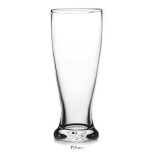 An empty pilsner glass from the Simon Pearce Ascutney Drinkware Collection stands upright on a white background, highlighting the collection's refined handmade barware craftsmanship.