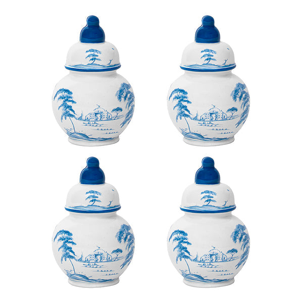 The Juliska Country Estate Place Card Holder Set includes four Delft Blue miniature ginger jars with blue lids and scenic house, tree, and hill designs—ideal as unique place card holders or charming table decor.