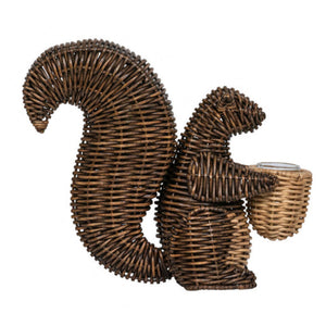 The Juliska Devon Willow Squirrel Flameless Candle Holder features a hand-woven design with a detailed curved tail and holds a small basket, perfect as a decorative accent or for displaying a flameless candle.