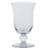 The Juliska Provence Basil Drinkware Collection features a textured glass goblet with a flared rim, round base, and decorative stem, inspired by Provence glasses and shown on a white background.