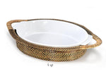 The Calaisio Oval Stoneware Roaster and Basket Collection features a 4-quart white roaster in a handled oval basket with a heat-resistant tray for easy serving.