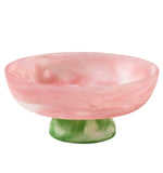 The Benno Large Fruit Bowl Collection by Blue Pheasant showcases a pink and white marbled bowl atop a green and white marbled pedestal, creating a bold two-toned design with complementary colors.