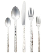 The Annella 5 Piece Flatware Set by Blue Pheasant features vertically arranged hammered stainless steel pieces—including a knife, two forks, and two spoons—with textured handles, all displayed on a white background.