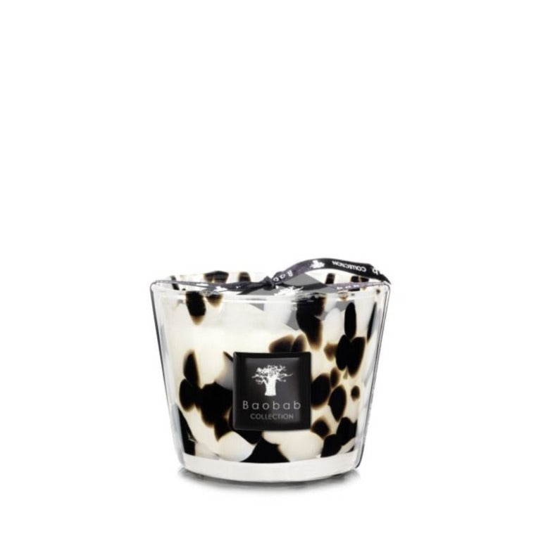 A Baobab Collection Pearls Black Candle in a glass holder with a black and white animal print design, isolated on a white background.