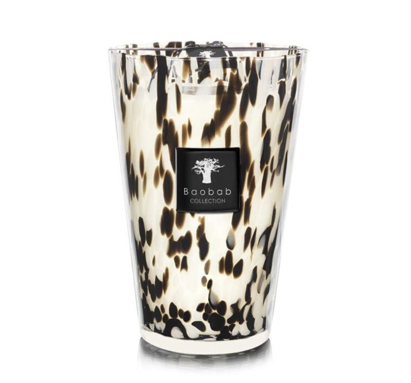 Decorative Baobab Collection Pearls Black Candle in a hand-blown glass holder with a tortoiseshell pattern and the label "Baobab Collection.