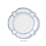 A white dinner plate with a scalloped edge and blue bamboo-style border from the Melamine Bamboo Dinnerware Collection by Two's Company is displayed on a plain white background. The label "Dinner Plate" appears beneath.