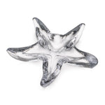 The Simon Pearce Starfish Glassware Collection features clear glass bowls, starfish-shaped and perfect as a charming summer host gift or a unique beachcombing-inspired present.