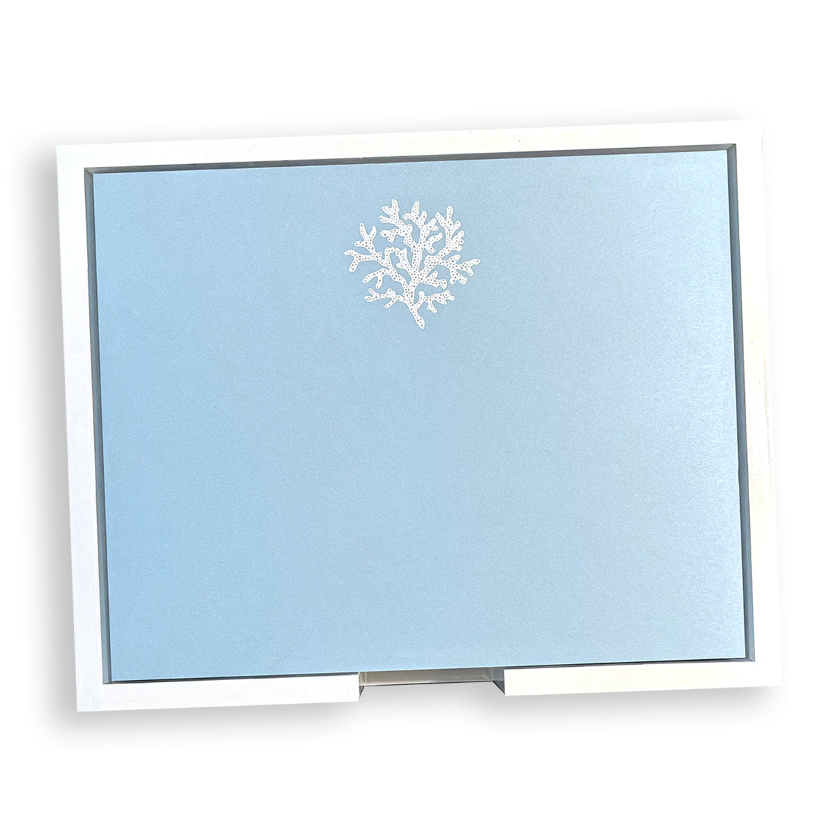 The Black Ink Large Blue Note Pad Collection features a Bristol Vellum Blue card with a white embossed coral design, neatly packaged in a white rectangular box—ideal for notes or creative projects, available in 175 sheets or as a unique foil leaf pad.