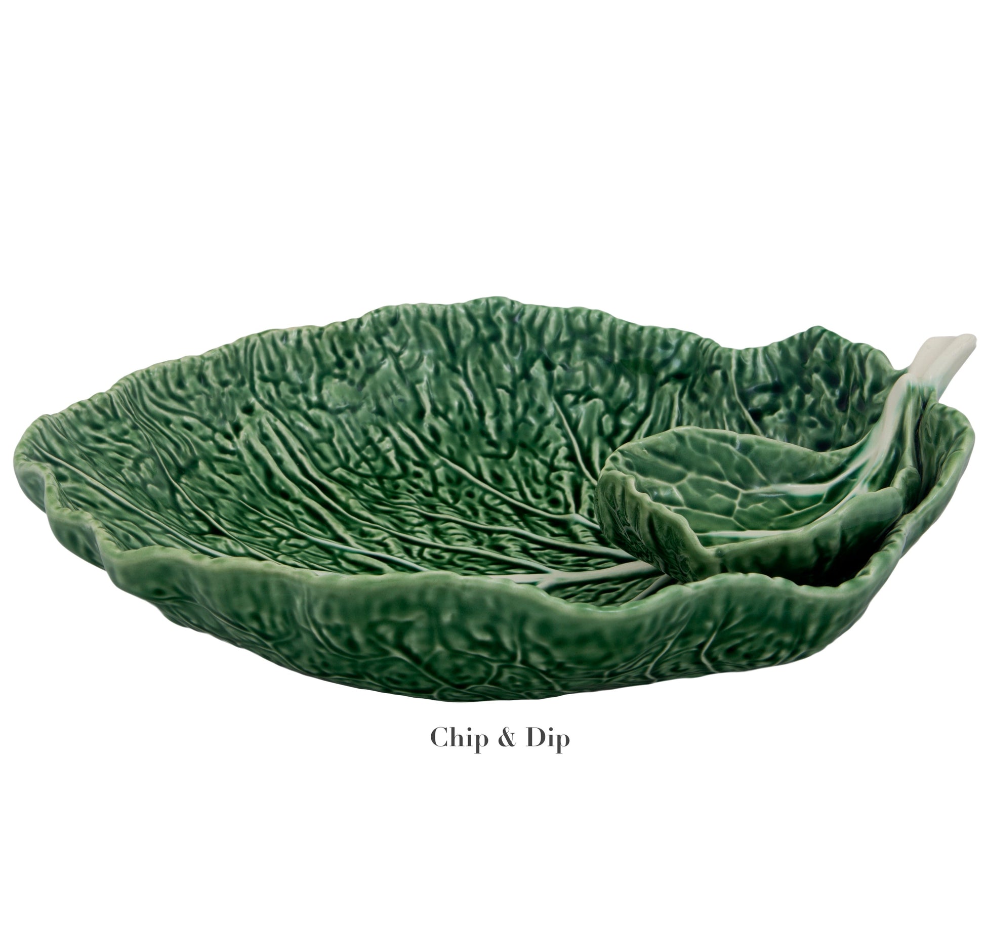 The Bordallo Pinheiro Cabbage Leaf Green Collection features an exquisite ceramic chip and dip platter, resembling cabbage leaves, with a matching bowl and spoon. Made in Portugal, this stunning set from Bordallo Pinheiro elevates any dining experience.