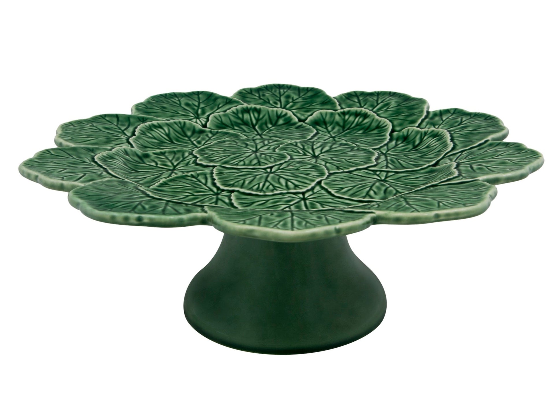 A green ceramic pedestal cake stand from Hive’s Geranium Leaf Serveware Collection, featuring a leaf-shaped and textured top—a refined piece inspired by nature.