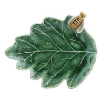 The Bordallo Pinheiro Countryside Leaves Dish Collection features a green ceramic leaf-shaped dish with a small bee figurine—ideal as a whimsical catchall or decorative accent for your home.