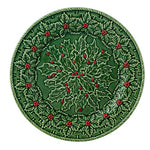 The Hive Holly Serveware Collection features handmade earthenware plates with raised holly leaf and berry wreath designs—ideal for festive holiday table decor.