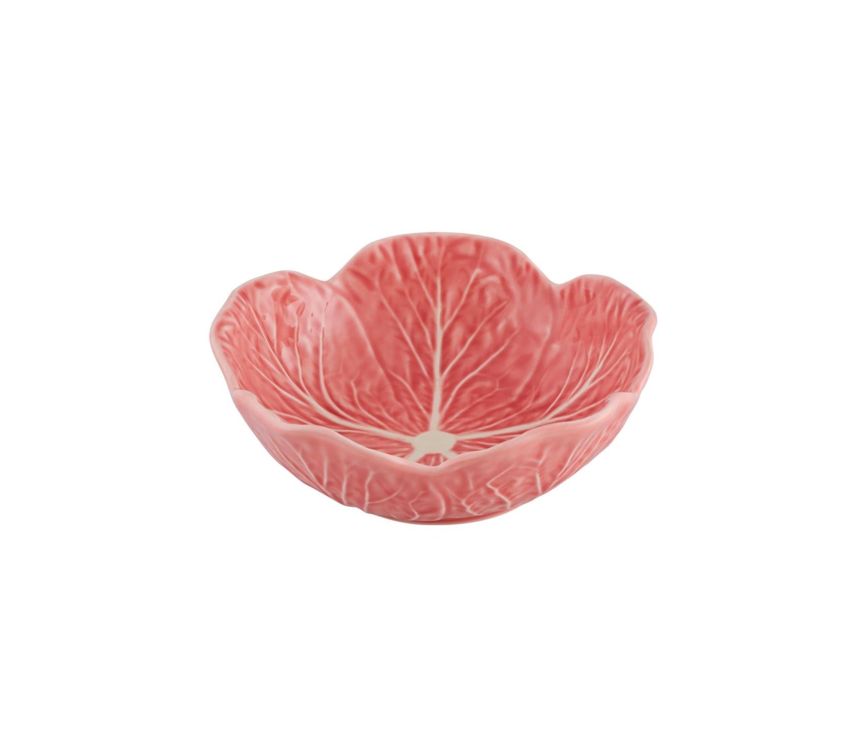 A pink ceramic bowl from the Hive Pink Cabbage Leaf Dinnerware and Serveware Collection is shaped and textured like a cabbage leaf, shown angled against a white background.