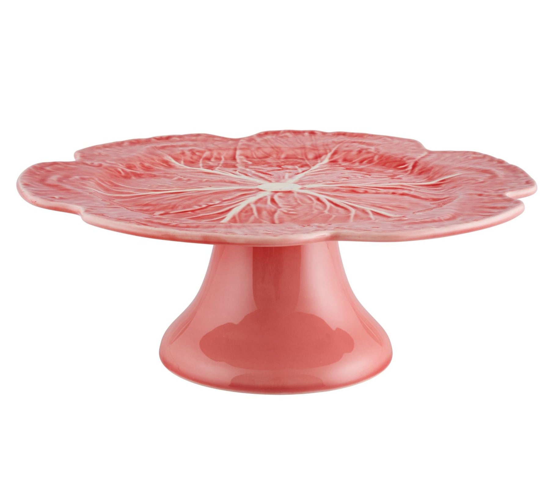 A pink ceramic cake stand from Hive’s Pink Cabbage Leaf Dinnerware and Serveware Collection, featuring a petal-shaped, textured top and a wide, flared base.